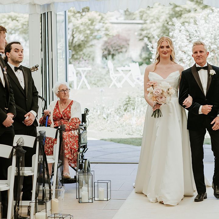 father-of-the-bride-walks-bride-down-the-aisle