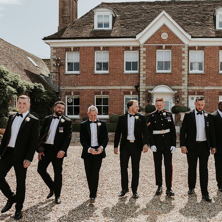 groomsmen-in-black-tuxedos-at-country-house