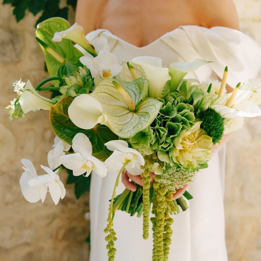 bride-carrying-white-wedding-bouquet