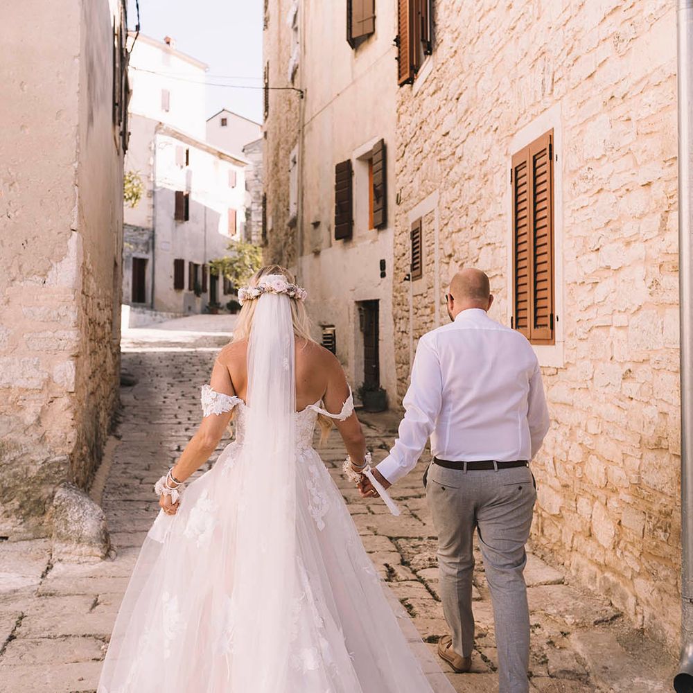 bride-in-floral-lace-wedding-dress-with-groom-in-white-shirt.