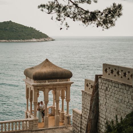 Couple portrait on the seafront at villa wedding 
