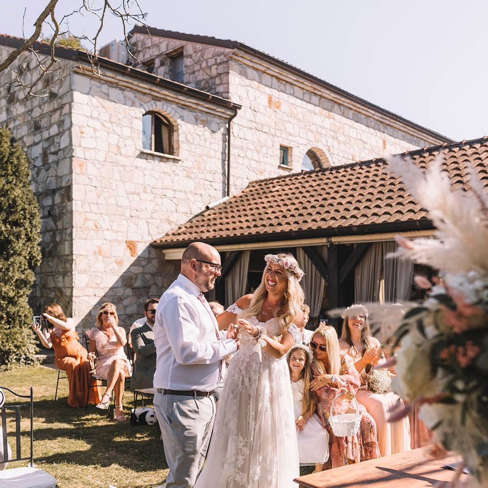 groom-in-white-shirt-and-pink-tie-with-bride-in-off-the-shoulder