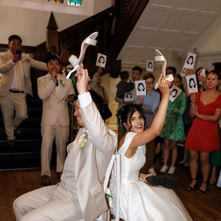 Mr & Mrs Quiz Game with Couple Raising The Brides Shoes