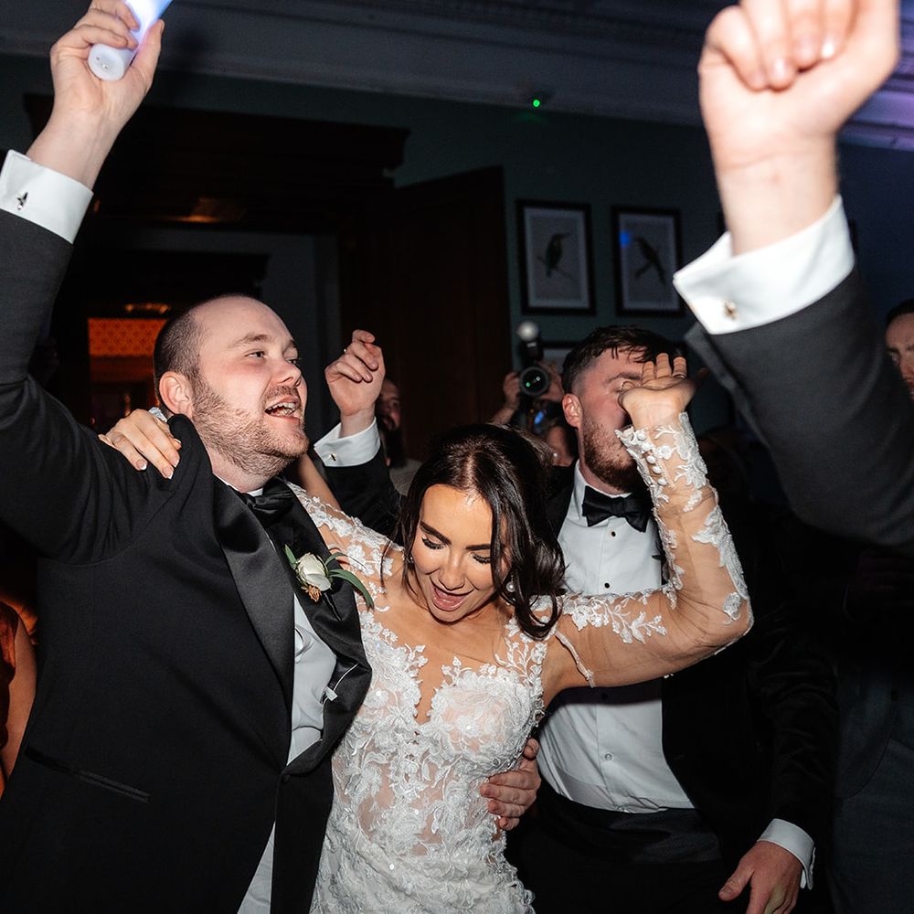 bride-and-groom-dancing-to-dj-together.