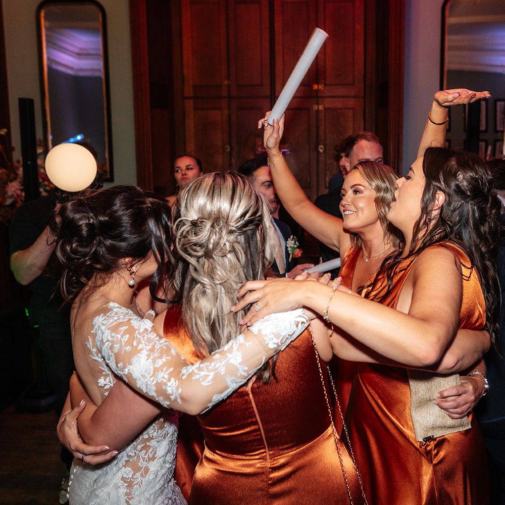 bridesmaids-in-matching-dresses-dancing-at-reception