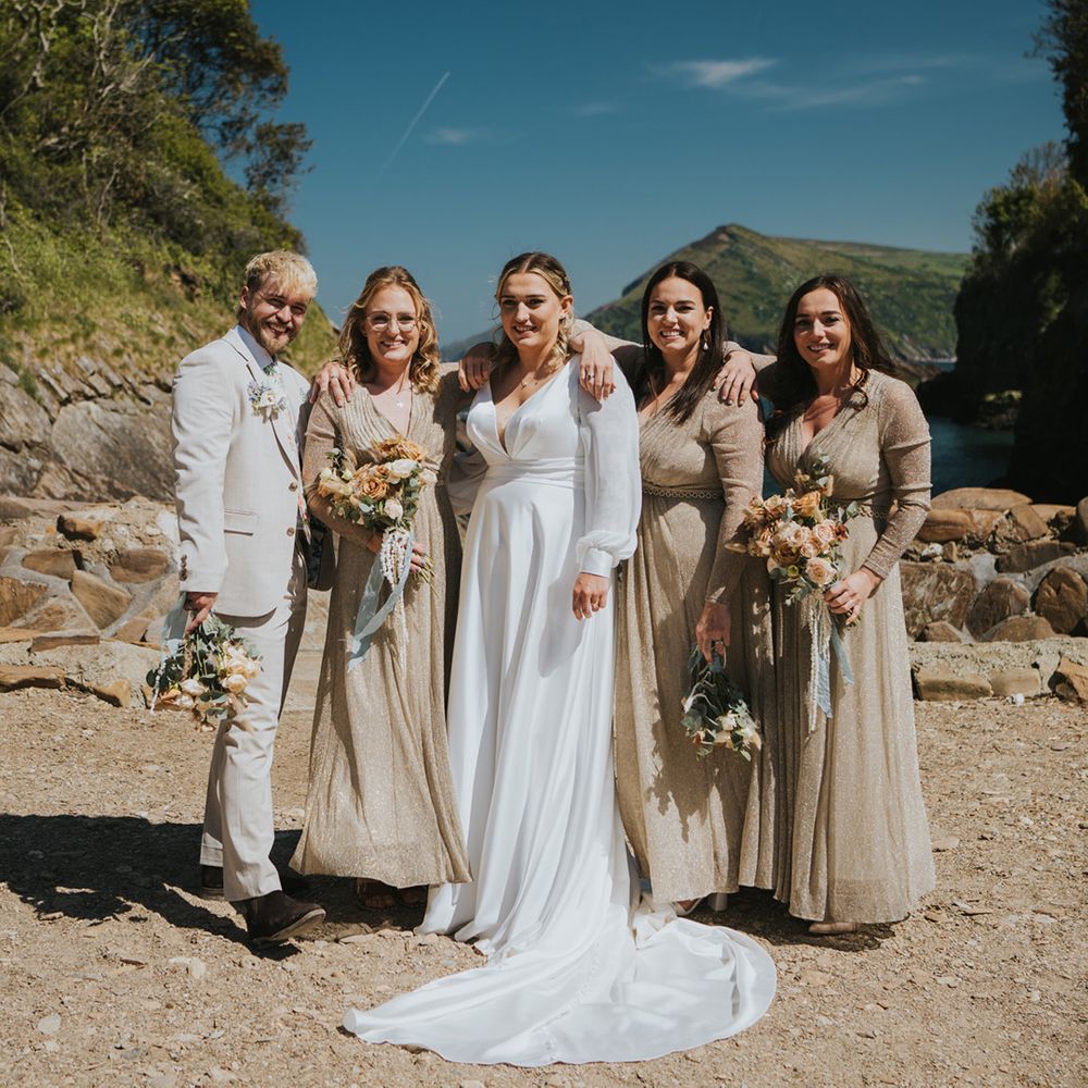 bridal-party-with-man-with-floral-tie-and-bridesmaids-in-gold-dresses