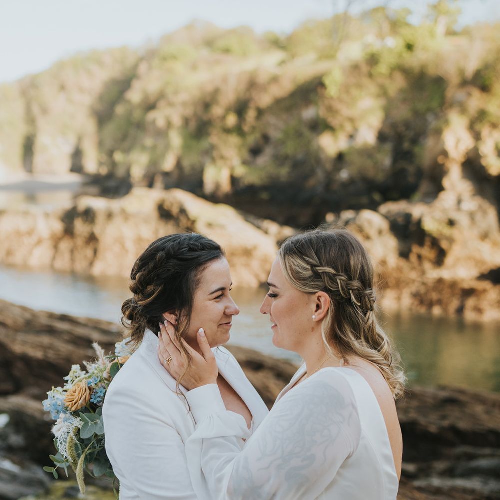 brides-look-into-each-others-eyes-for-couple-portrait