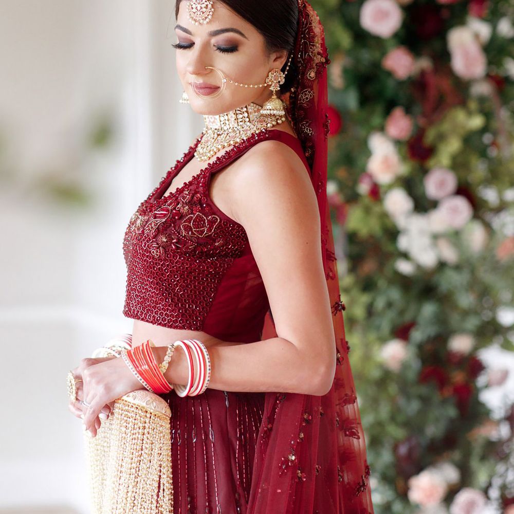 Traditional burgundy wedding dress for Sikh bride