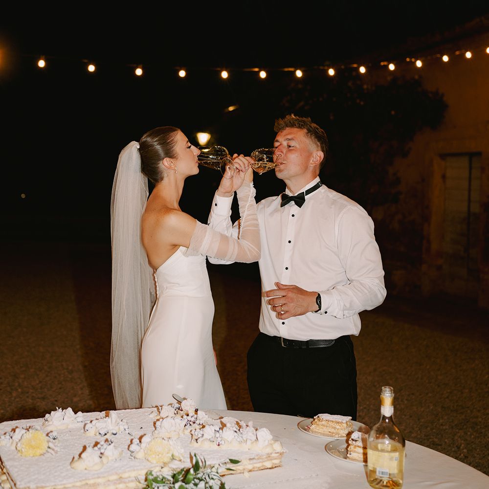 bride-and-groom-loop-wine-glasses-and-drink-together