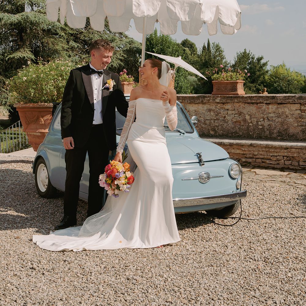 bride-and-groom-next-to-vintage-blue-fiat