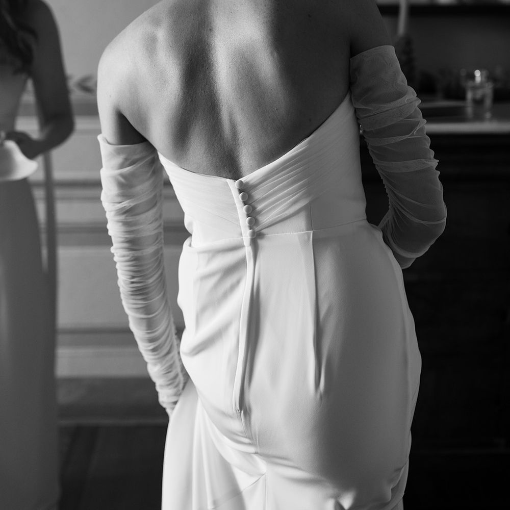 bride-in-strapless-button-wedding-dress-with-mesh-gloves