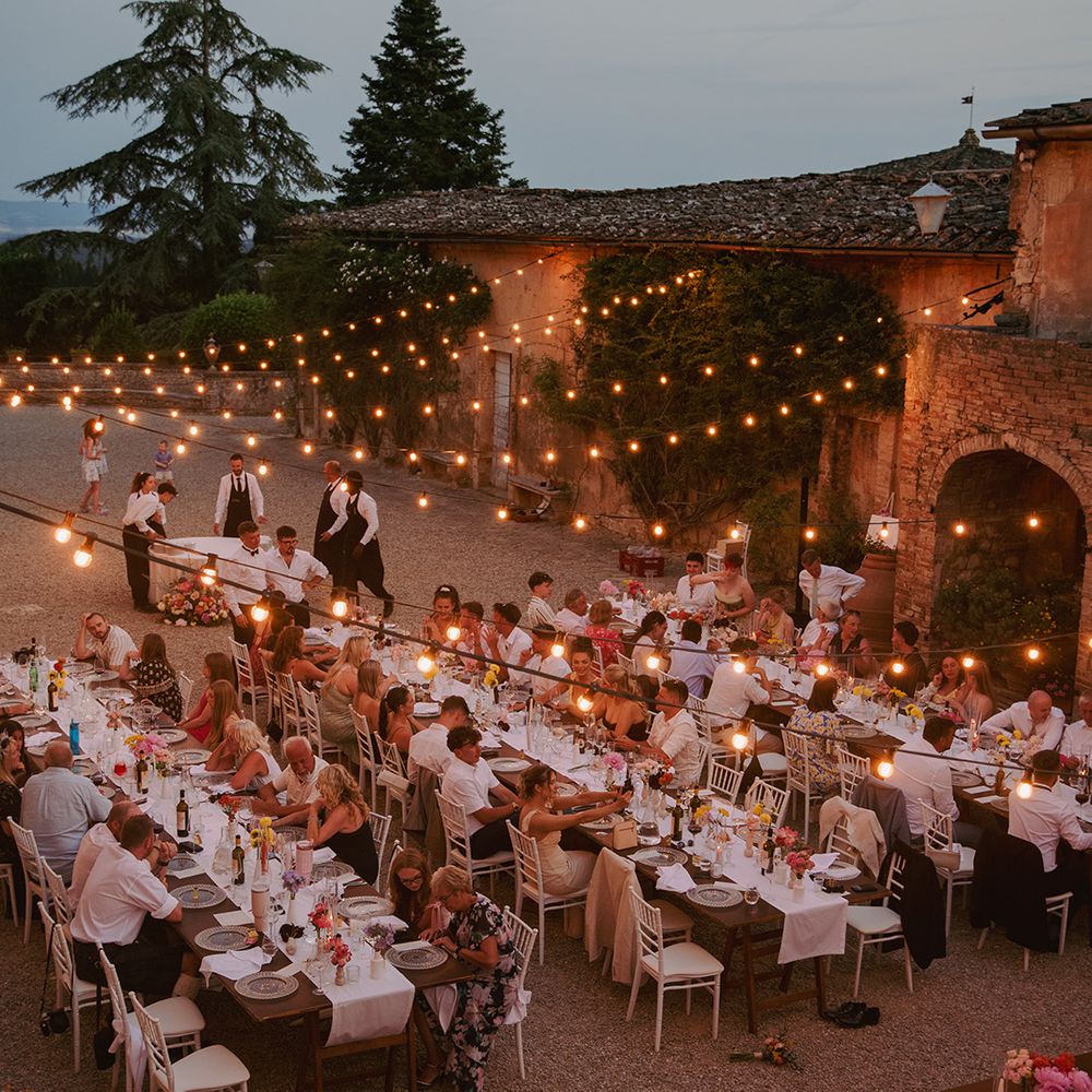 outdoor-wedding-breakfast-with-festoon-lighting-canopy