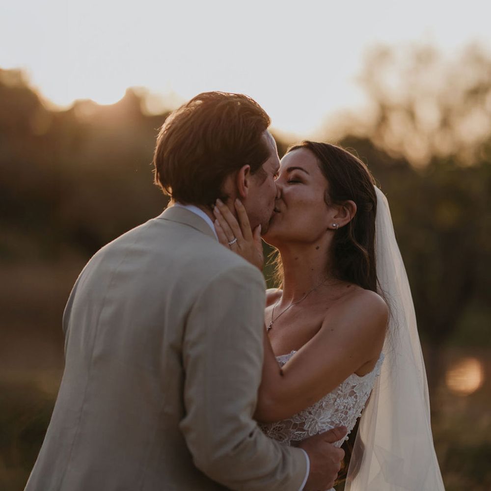 bride-and-groom-kiss-during-golden-hour