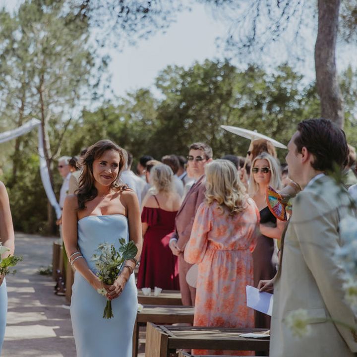 bridesmaids-in-matching-pastel-blue-strapless-satin-dresses-walking-down-the-aisle