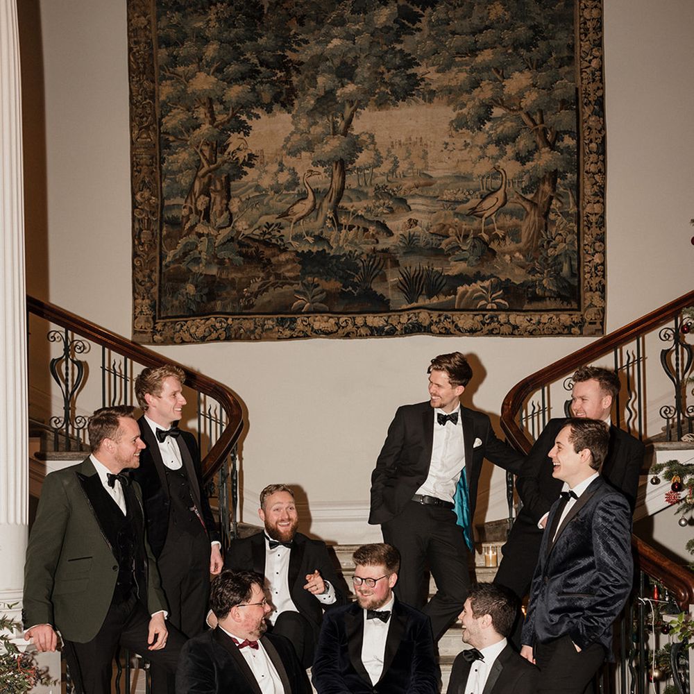 groom-and-groomsmen-in-black-tuxedos