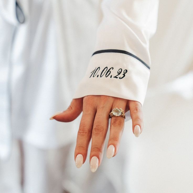 Bride Wearing Personalised Embroidered Wedding Pyjamas with Engagement Ring