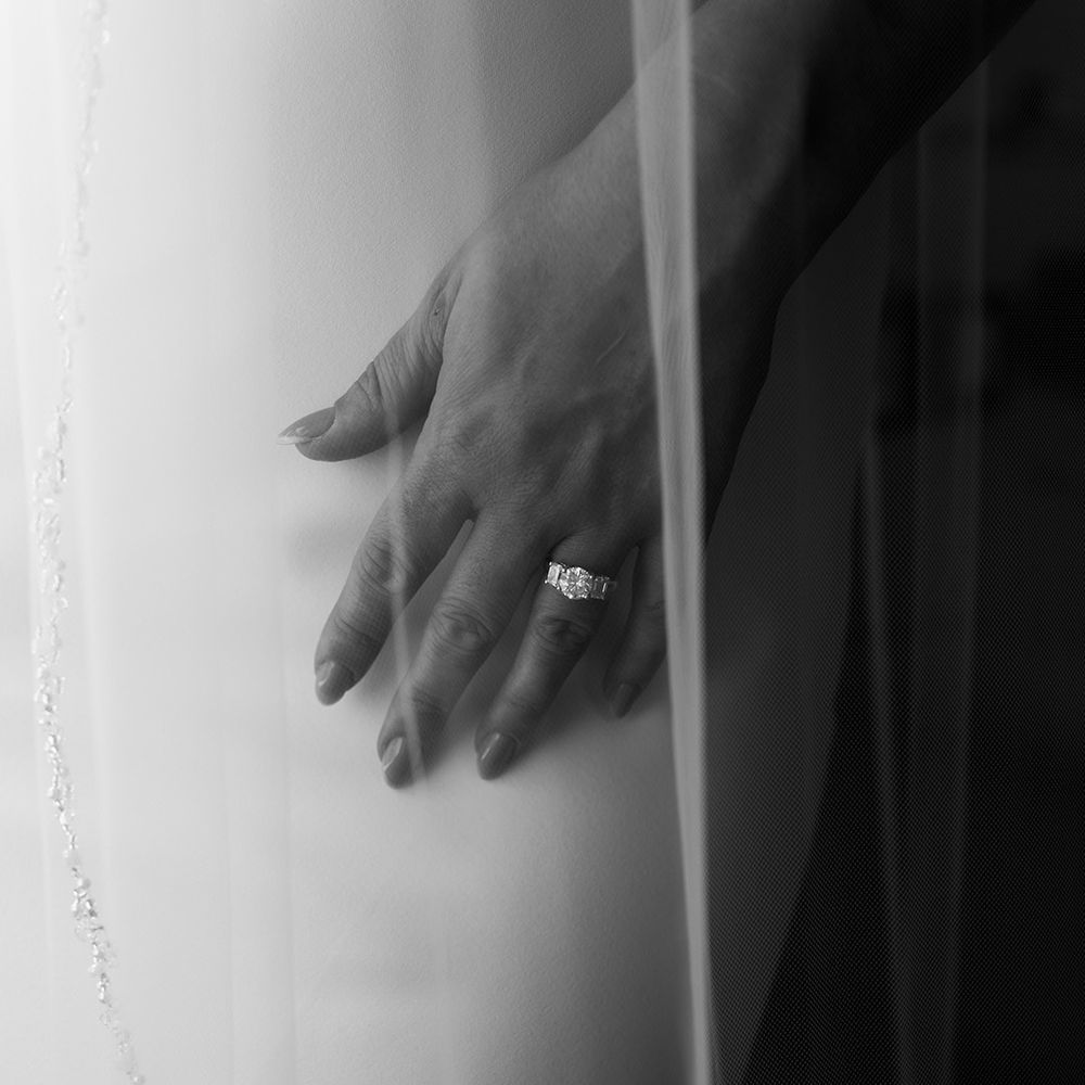 bride-wearing-diamond-engagement-and-wedding-ring