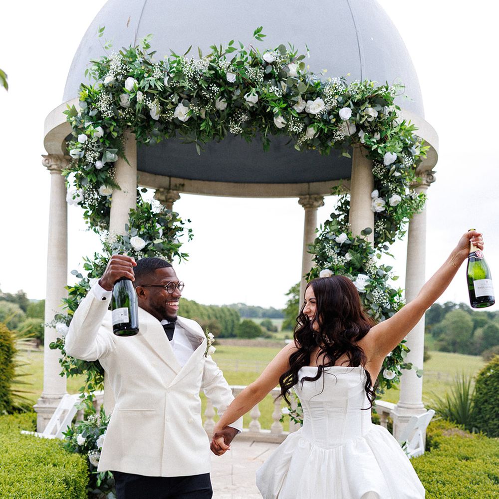 bride-in-short-puff-wedding-reception-dress-celebrating-with-groom