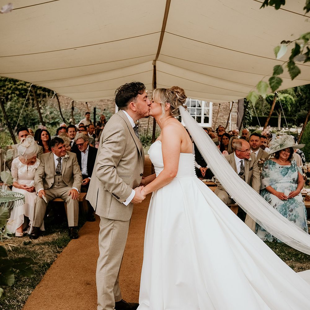 bride-and-groom-have-first-kiss-as-married-couple