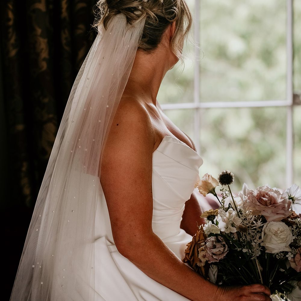 bride-with-hair-in-updo-hairstyle-with-veil