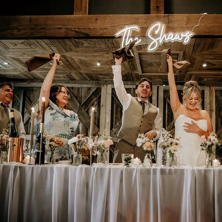 wedding-guests-waving-napkins-at-rustic-wedding
