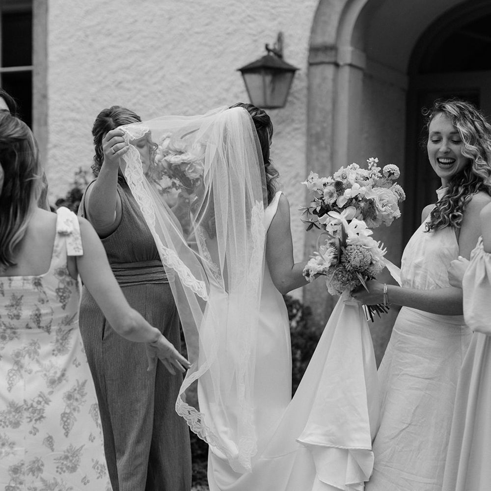 bride-and-bridesmaids-chatting