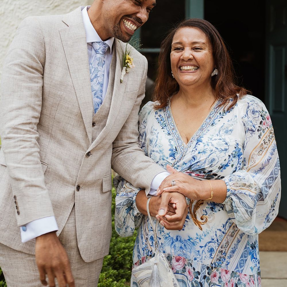 groom-laughing-with-wedding-guest