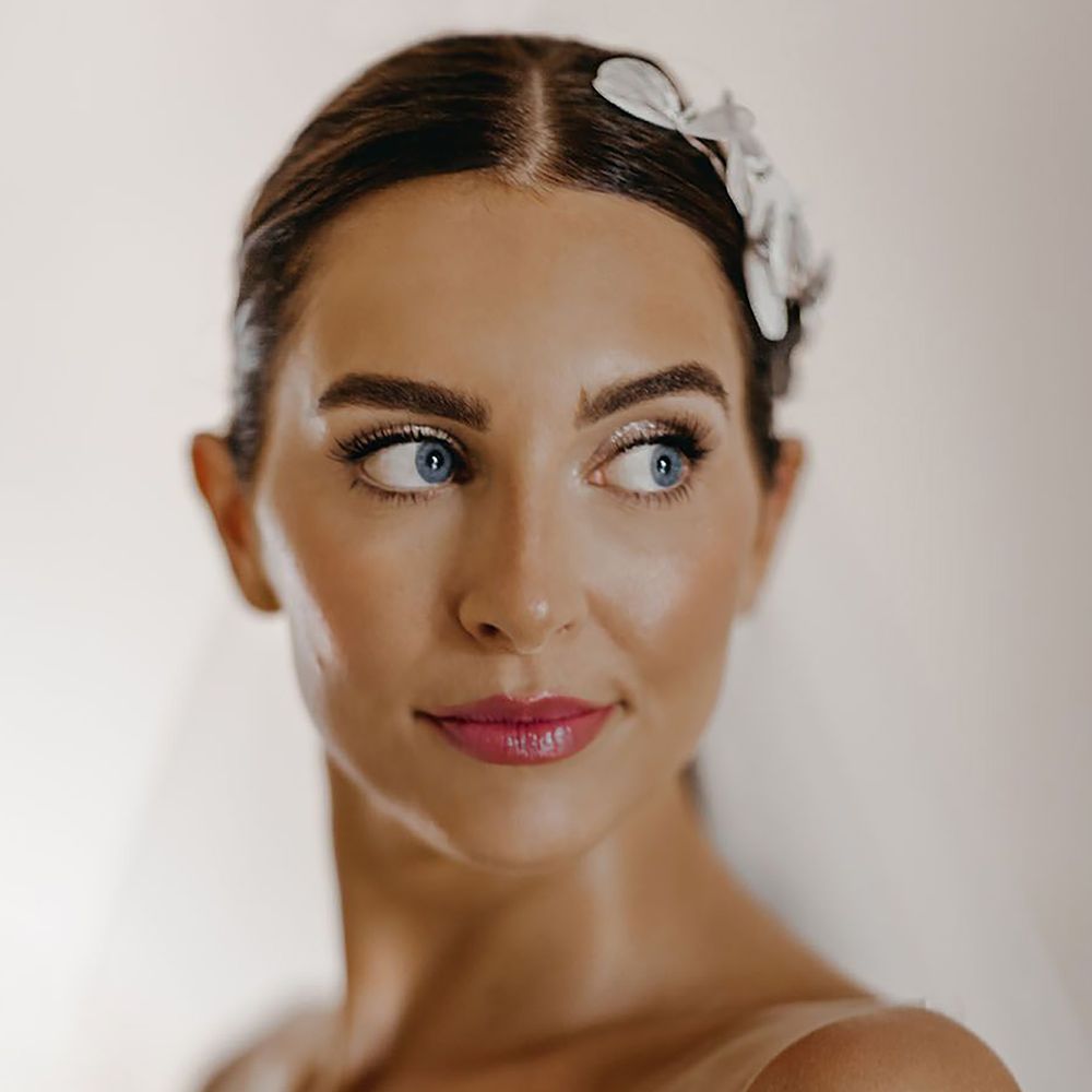 Bride with a pink lip and glittery eyeshadow wedding makeup