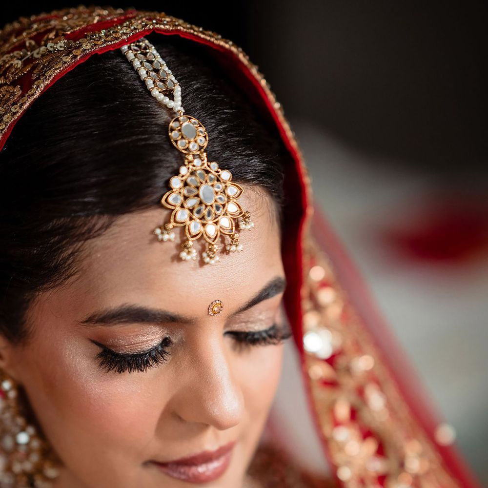 Soft glam bridal makeup with matte base, shimmery eye makeup and false lashes