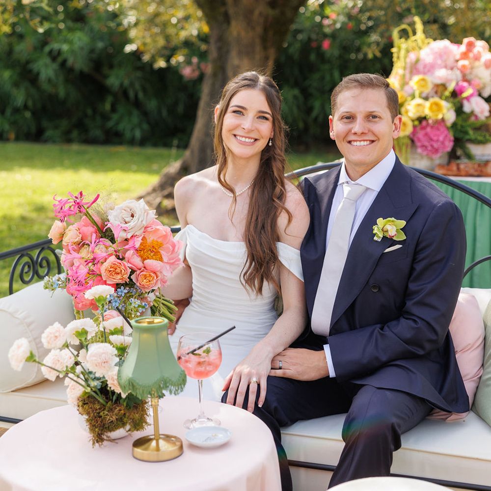 bride-and-groom-seated-at-villa-medicea-di-lilliano-wedding