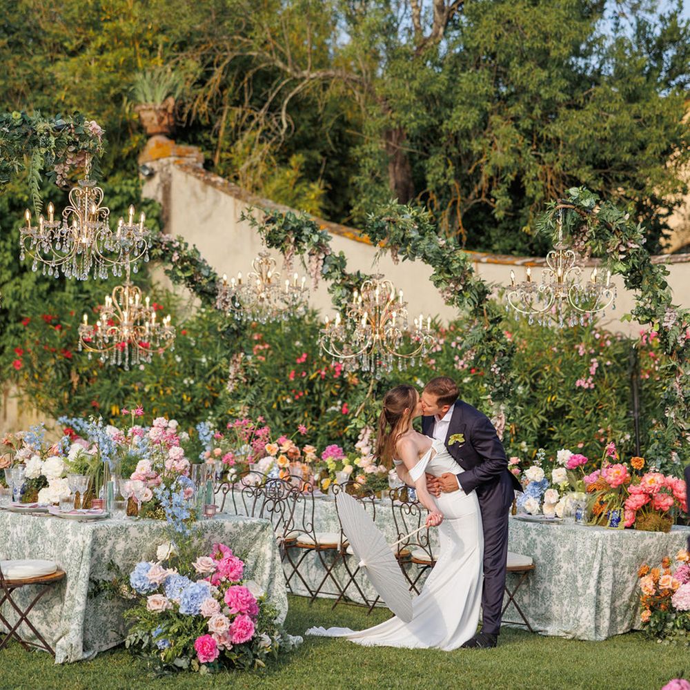 couple-kisses-at-beautiful-villa-medicea-di-lilliano-wedding