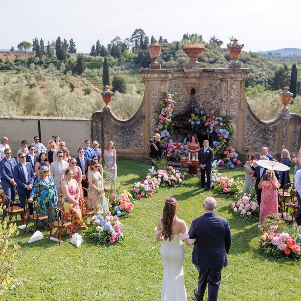 father-of-the-bride-walks-down-the-aisle-with-bride