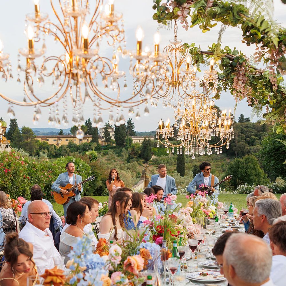 Villa Medicea di Lilliano with chandeliers over banquet tables for intimate wedding
