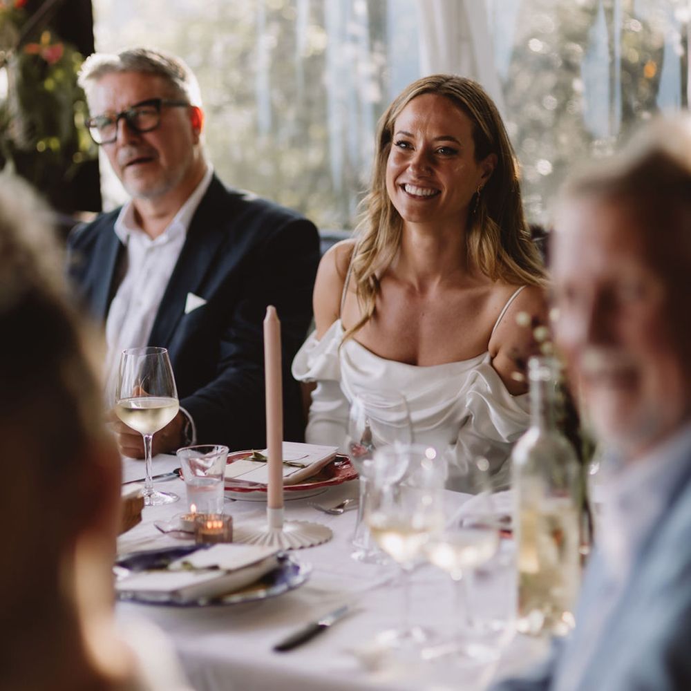 bride-smiles-during-the-wedding-speeches