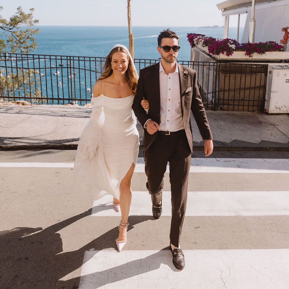 groom-crosses-the-road-with-bride-at-positano-wedding