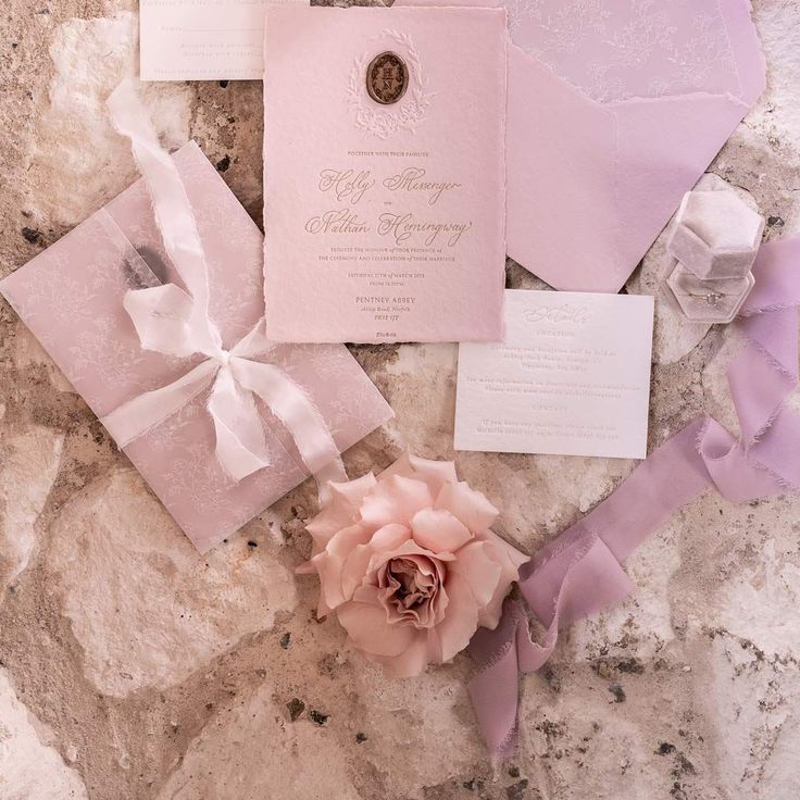 Dainty Light Purple And Lilac Wedding Stationery With Lilac Ribbon And Blush Garden Roses On Stone