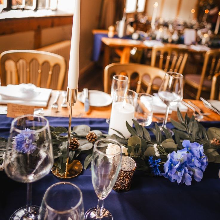 Purple Wedding Tablescape with White Taper Candles & Flowers