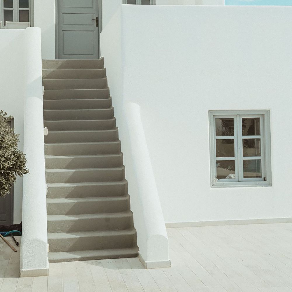 All inclusive honeymoon destination with classic white greek buildings in santorini