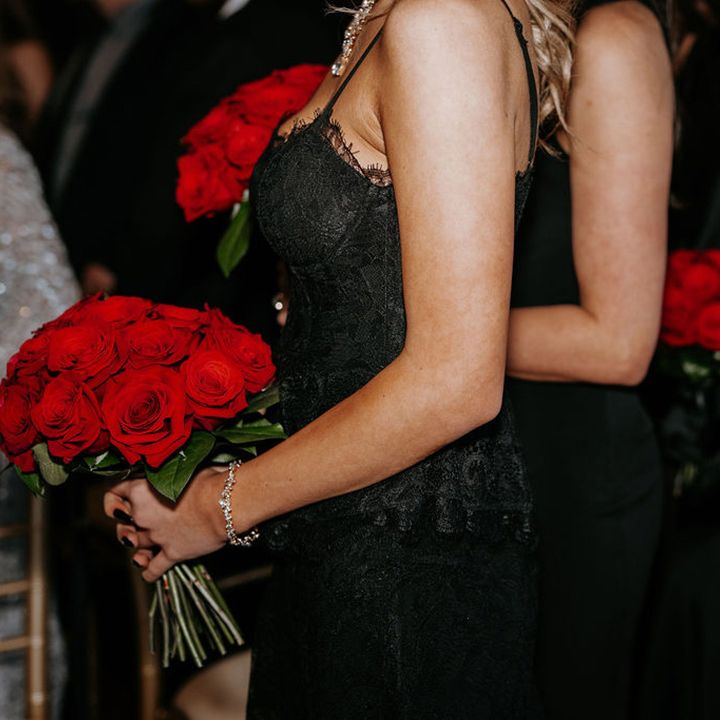 black-bridesmaid-dress-with-red-rose-bouquet