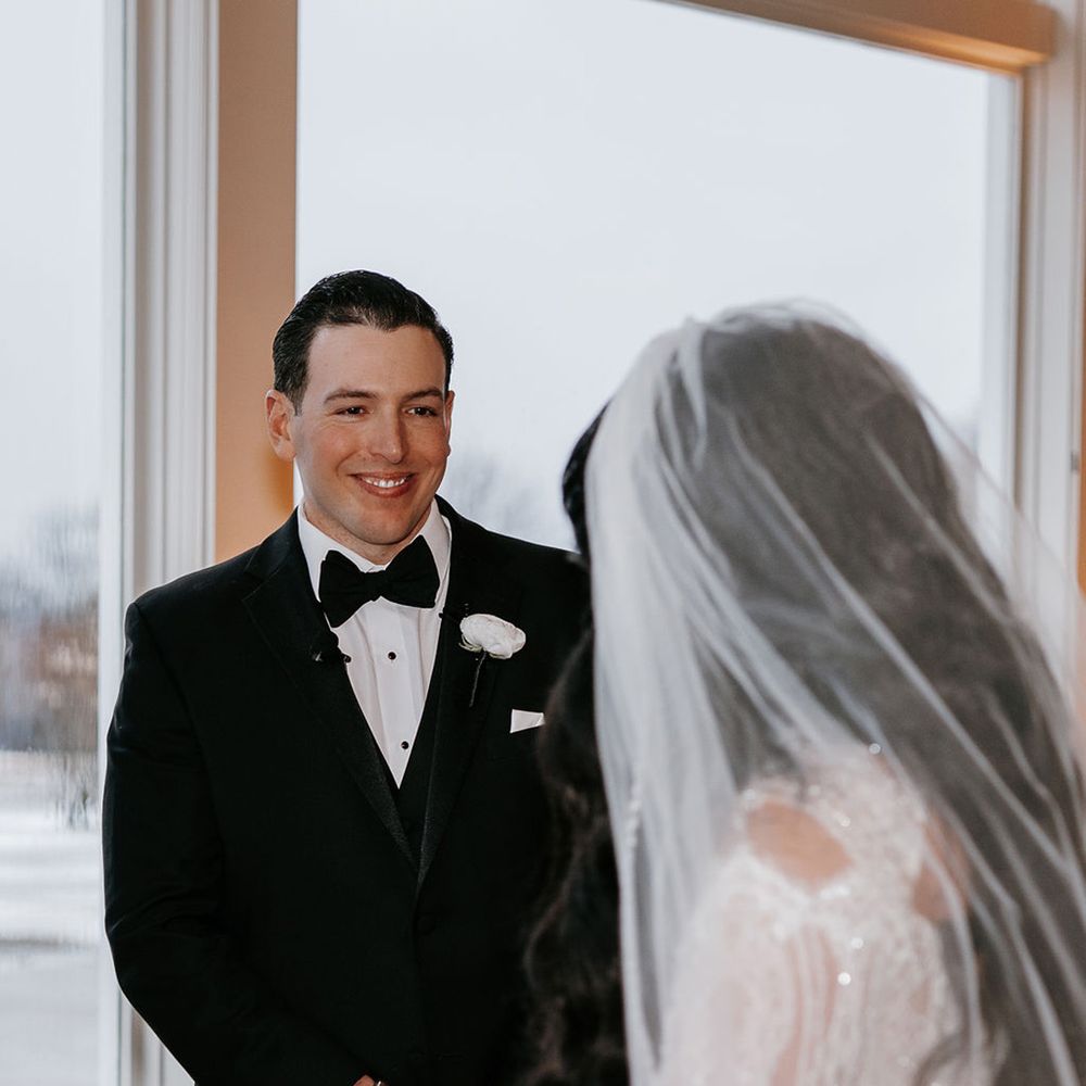 groom-smiles-seeing-bride-for-the-first-time