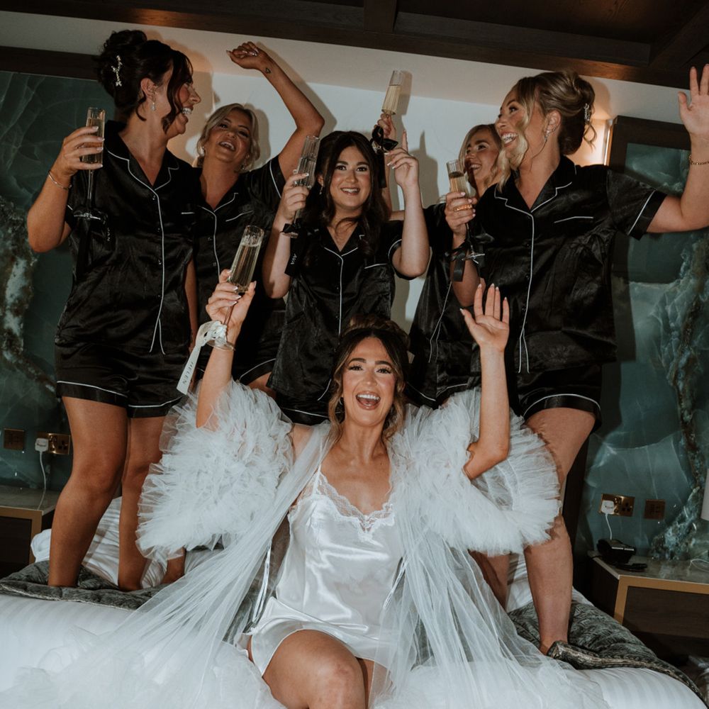 bridesmaids-wearing-black-satin-pyjamas