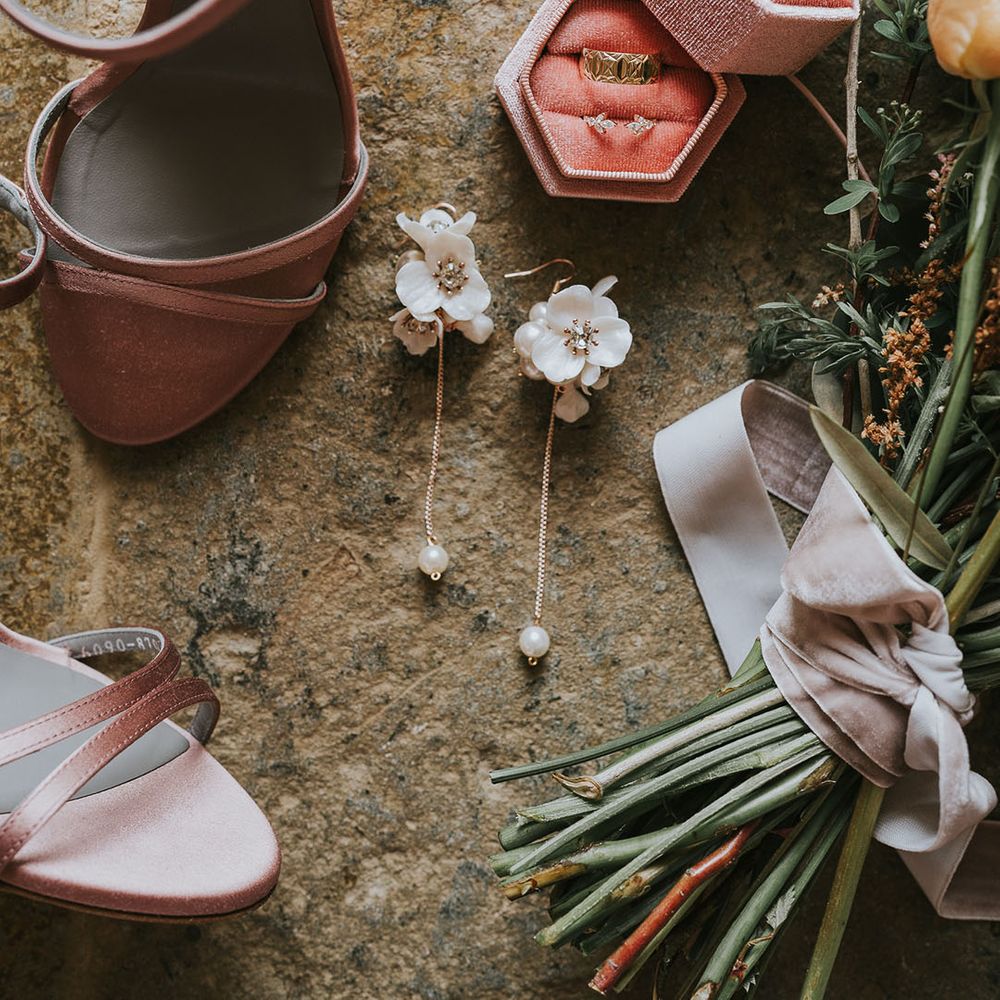 Bridal accessories with engagement and wedding ring in pink box
