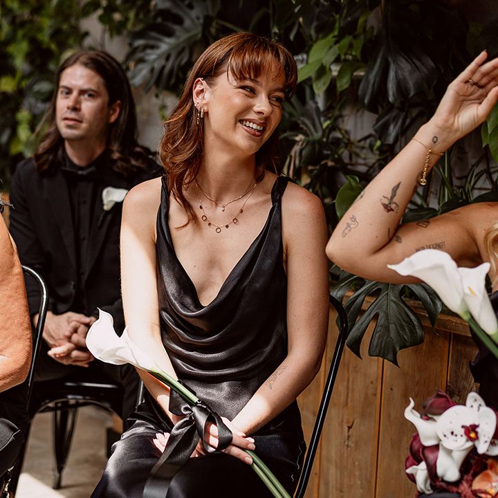 bridal-party-laughing-in-black-bridesmaid-dresses