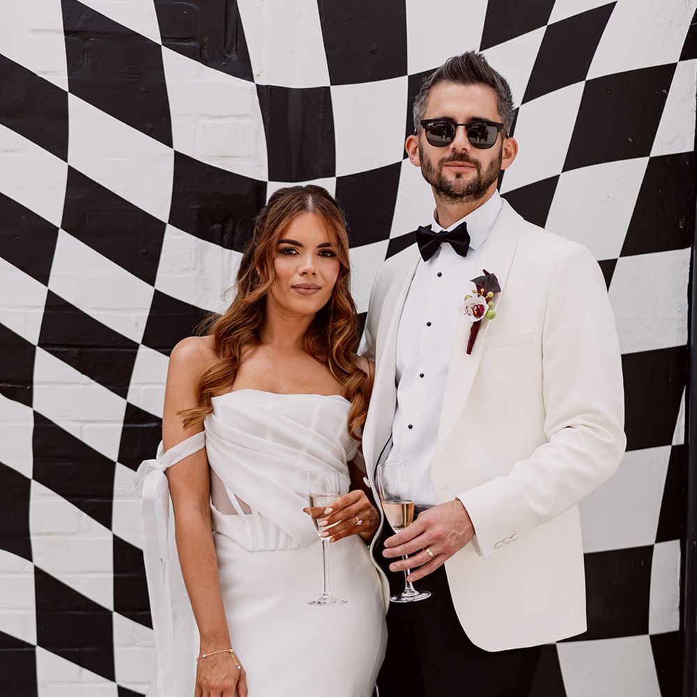 checkered-board-backdrop-for-wedding-photos-with-black-tie-wedding-fashion