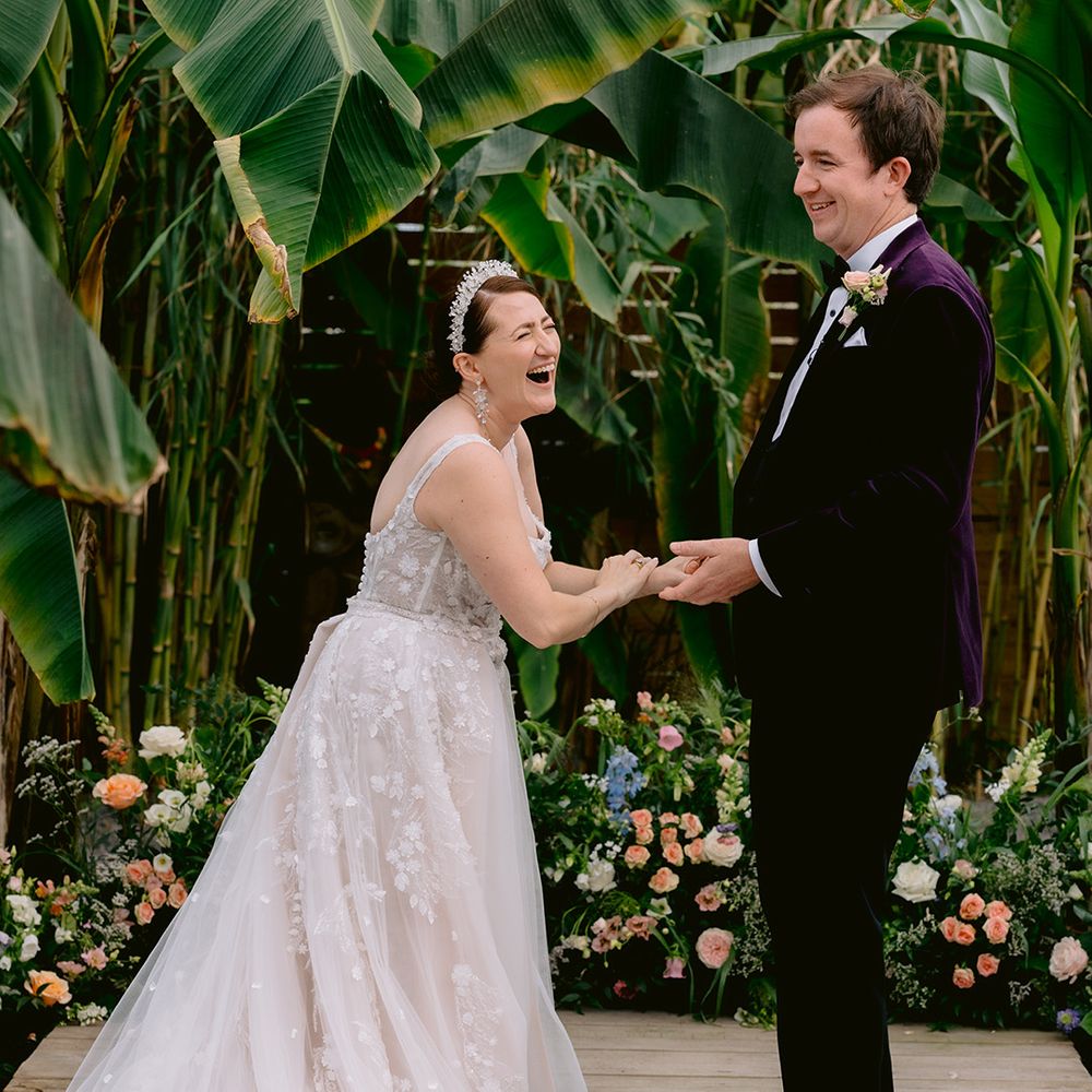couple-laughs-together-during-weddding-ceremony