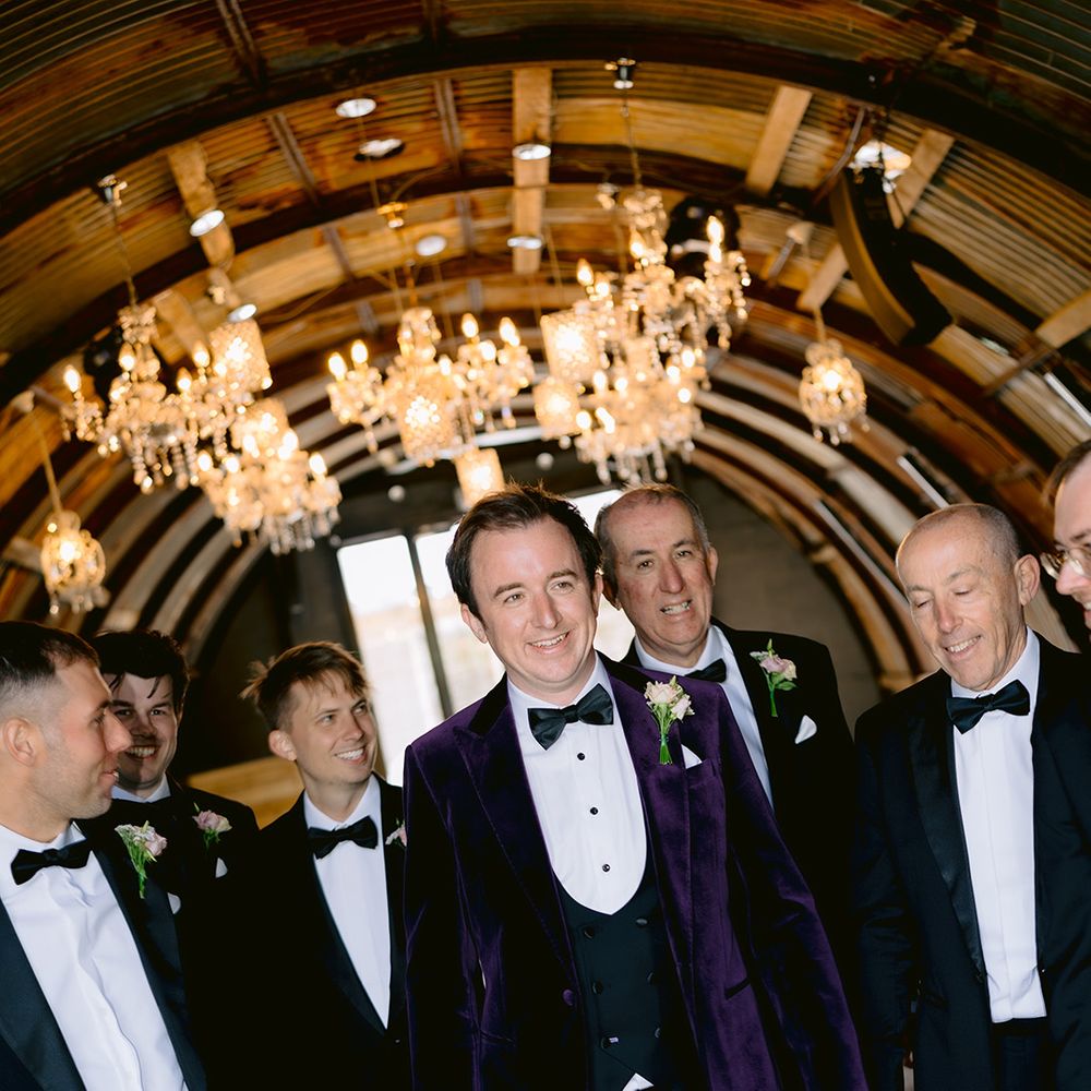 groom-in-purple-velvet-tuxedo-with-groomsmen