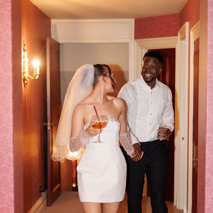 Bride In Short Wedding Reception Dress With Embellished Details