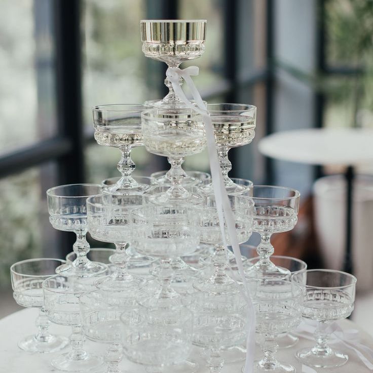 Elegant Champagne Tower Decor with Pink Bows