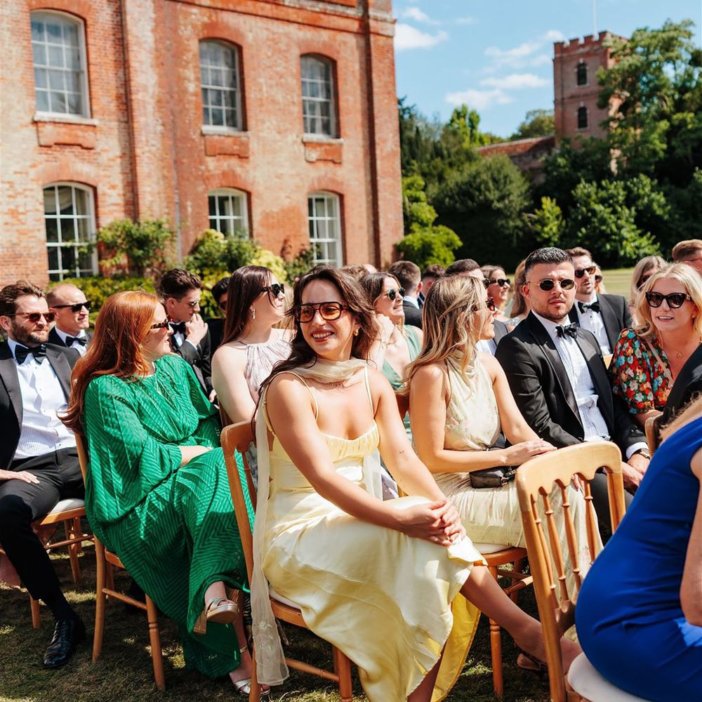 Wedding guest wearing a butter yellow dress