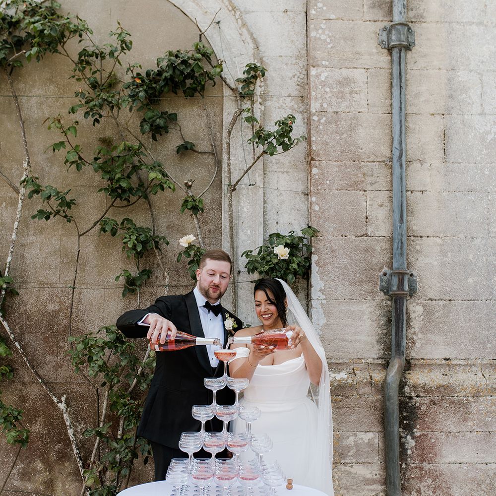 bride-and-groom-pour-rose-prosecco-tower